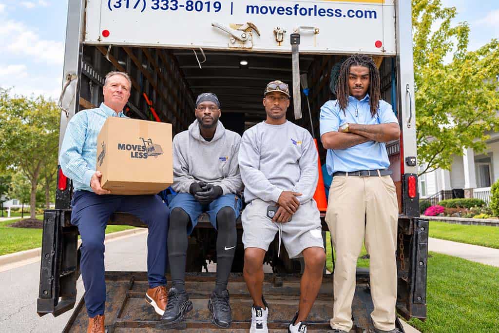 Crew Seated in Box Truck Moving crew seated in the back of a branded box truck
